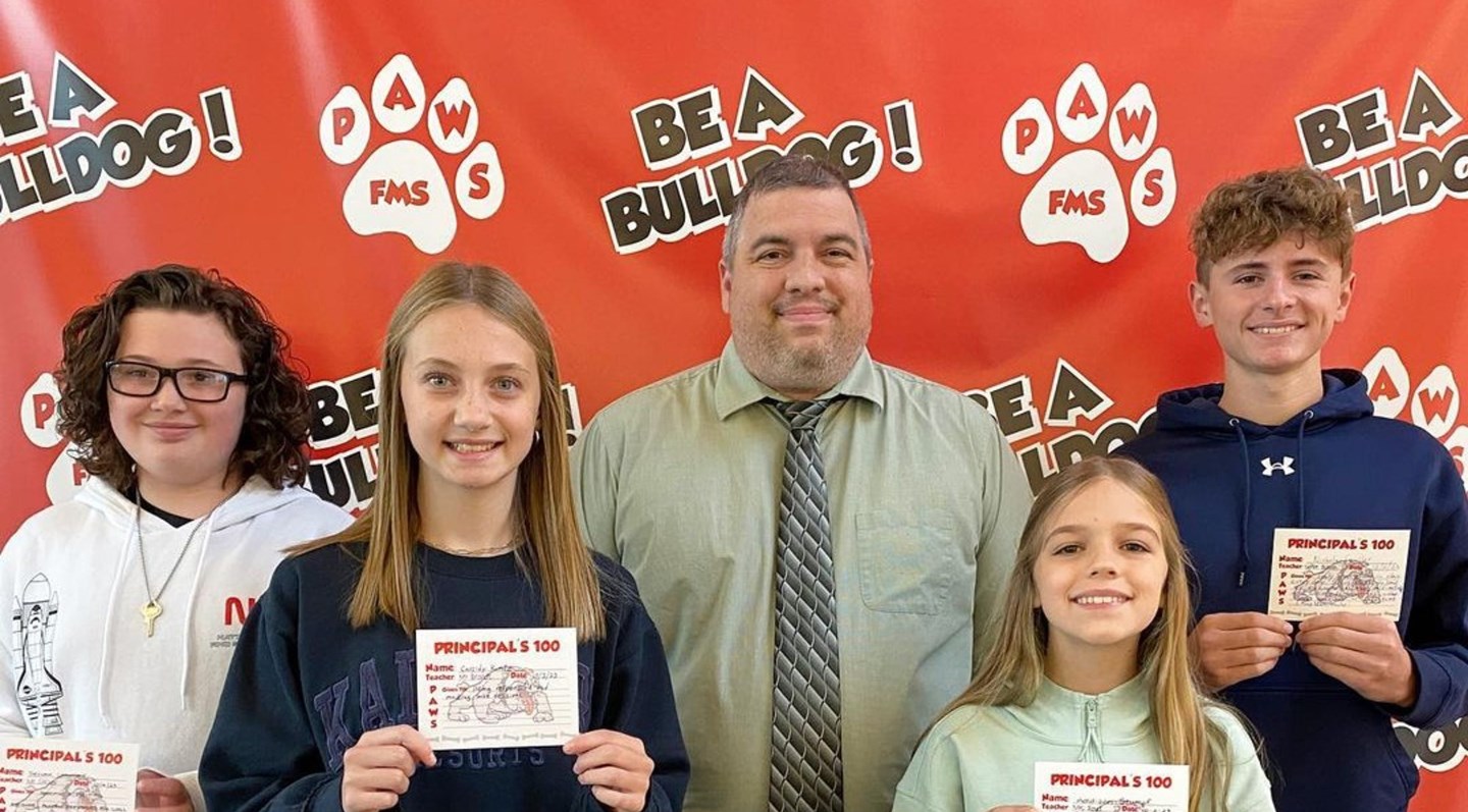 Red background with white paws with paws/fms written on it.  Also written on it is Be a bulldog! 